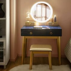 a desk with a mirror and stool in front of it