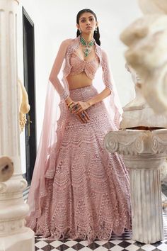 Blush pink attached can-can lehenga with all over scallop embroidery in pearls, crystals, thread and sequin work. Paired with a padded blouse with all over crystal and pearl embroidery. Comes along with a scallop trimmed dupatta with pearls, sequin and crystal embroidered border.
Components: 3
Pattern: Embroidery, Embellished
Type Of Work: Pearls, Crystals, Sequin, Thread
Neckline: Sweetheart Neck
Sleeve Type: Sleeveless
Fabric: Organza
Color: Pink
Other Details: 
Model height: 5 ft 7 inches, we Pearl Lehenga, Scallop Embroidery, Embroidery Pearls, Ridhima Bhasin, Seema Gujral, Desi Fits, Sequence Blouse, Blouse Tops Designs, Organza Embroidery