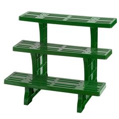 three tiered green plastic shelf on white background