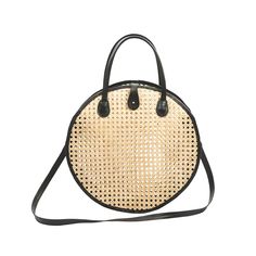 Our leather and rattan crossbody shoulder bag features a modern round geometric shape that adds a unique touch to this style. The shoulder strap allows you to carry your essentials hands free. (PRODUCT INFO): Material: Lambskin leather + Rattan cane webbing Size: 12" H x 12" L x 3.5" D inches Removable crossbody shoulder strap Signature button closure. On-the-go Crossbody Straw Bag With Adjustable Strap, Chic Straw Bag With Adjustable Strap And Round Handle, Summer Leather Shoulder Bag With Round Handle, Leather Shoulder Bag With Round Handle For Summer, Modern Summer Shoulder Bag With Bamboo Handle, Modern Shoulder Bag With Bamboo Handle For Summer, Natural Straw Bag With Adjustable Strap For On-the-go, Modern Straw Bag With Detachable Strap For Travel, Modern Summer Straw Bag With Detachable Strap