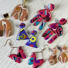 Small batch handmade polymer clay earrings. If there is a greater quantity sold than shown in the picture, colors and patterns may have slight variations.  All earrings are lightweight and a variety of lengths and fastener types. Information on a specific earring's length and fastener metal type is listed in the photo description. Please handle the earrings with care. While they are durable, they should not be bent or exposed to water for long periods of time. They can be cleaned gently with mild soap and water.  Please contact me if there is an issue with the earrings you were sent. If there's a problem I'm happy to find a solution! Fun Hand-painted Pink Earrings, Fun Pink Polymer Clay Earrings, Fun Hand Painted Pink Earrings, Playful Hand Painted Pink Earrings, Funky Handmade Pink Earrings, Artsy Pink Polymer Clay Earrings, Pink Artsy Polymer Clay Earrings, Funky Pink Handmade Earrings, Funky Pink Earrings For Gift