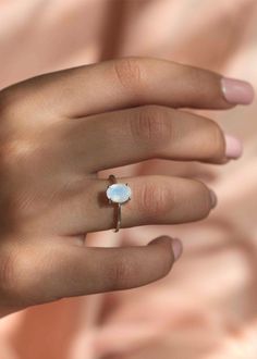 This stunning delicate Moonstone Ring is handmade with genuine natural faceted moonstone in an oval shape in 925 sterling silver. An everyday classic piece of jewelry with a touch of modern, you will never regret investing in. Every stone has a subtle blue flash on its smooth surface. Securely set in our sleek prong setting. D E T A I L S > Materials - .925 sterling silver, genuine natural rainbow moonstone, 18k gold vermeil (Nickel free thick gold plating over sterling silver) > Size - 8m Minimalist Silver Moonstone Ring, Minimalist Silver Moonstone Ring In Sterling Silver, Minimalist Sterling Silver Moonstone Ring, Minimalist Silver Moonstone Ring With Polished Finish, Nickel-free Silver Sterling Moonstone Ring, Engagement Ring Moonstone, Ring Moonstone, Moonstone Ring Sterling Silver, Minimalist Engagement Ring