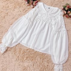 This price is for a blouse only.   	 		 			Size 			S 			M 			L 			XL 		 		 			Shoulders 			36 			37 			38 			39 		 		 			Bust 			90 			94 			98 			102 		 		 			Sleeve Length 			60 			61 			62 			63 		 		 			Full Length 			57 			58 			59 			60 Feminine White Blouse With Lantern Sleeves, White Padded Blouse With Lantern Sleeves, White Doll Collar Blouse, Feminine White Blouse With Collar, Spring Blouse With Lace Collar And Lantern Sleeves, White Blouse With Peter Pan Collar For Spring, Spring Tops With Lace Doll Collar, Spring Top With Lace Doll Collar, Spring Tops With Lace And Doll Collar