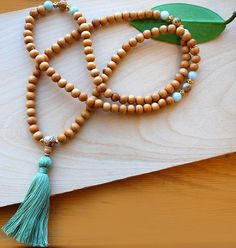 Japa Mala-Wood & Jade crafted with 8mm natural hard wood beads made from sturdy South Indian Kadam wood, genuine jadeite and picture jasper markers, finished with a natural cotton tassel. Bohemian Hand-strung Mala For Meditation, Adjustable Artisan Mala As A Gift, Spiritual Hand-knotted Jewelry For Festivals, Hand Knotted Spiritual Jewelry For Festivals, Holistic Hand Knotted Jewelry Gift, Bohemian Hand Knotted Mala For Meditation, Bohemian Hand-strung Adjustable Mala, Adjustable Bohemian Mala For Healing, Bohemian Adjustable Hand-strung Mala