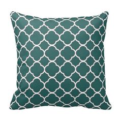 a green pillow with white circles on it