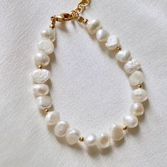 This beachy bracelet is an updated version of a classic. Freshwater nugget pearls Gold beaded accents Length: approx. 8" including extender Handmade in Utah by Katie Waltman Jewelry Beachy Bracelets, Gold Beads, Fresh Water, Utah, Bracelet, Gold