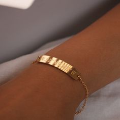 "This bracelet features coordinates, creating a unique and personalized message. Crafted with care, it's the perfect accessory to showcase a meaningful location or memory. Embrace the sentimentality of coordinates and make a statement with our Coordinate Personalized Message Bracelet, a cherished piece that beautifully captures your connection to a special place. #YOU MAY LIKE THIS silver bar cotton bracelet https://www.etsy.com/listing/1492776594/silver-bar-cotton-bracelet-best-gift Heart Charm Minimalist Yellow Gold Bracelets With Initials, Classic Gold Bracelets For Friendship, Everyday Yellow Gold Personalized Bracelets, Minimalist Personalized Gold Bracelet For Everyday, Personalized Minimalist Gold Bracelet For Everyday, Dainty Adjustable Name Bracelet Tarnish Resistant, Classic Engraved Gold Bracelet For Personalized Gift, Dainty Adjustable Name Bracelet, Dainty Customizable Gold Bracelets