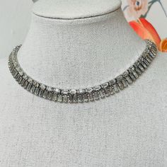 JOMAZ Joseph Mazer Rhinestone Choker Necklace, signed; Vintage, 1940's; Fold over clasp; Stunning simulated Diamond choker length necklace, superior glittering Austrian crystal rhinestones are all present, silver plated, gorgeous art deco design, amazing near mint condition for a piece that is 80+ years old; Dimensions: 14 inches long, 3/8 inches wide; Weight: 31.4 grams; Excellent (Near Mint) vintage condition; See photos for additional details; Please be conscious that vintage items have lived Rhinestone Choker Necklace, Diamond Choker, Length Necklace, Rhinestone Choker, Gorgeous Art, 80 Years, Austrian Crystal, Art Deco Design, Fold Over