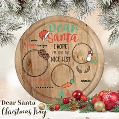 a wooden plaque with santa's help on the nice list and other christmas items