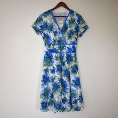 Coldwater Creek New With Tags! Blue Floral V-Neck Short Sleeve Sundress V-Neck Is Made With Overlapping Panels For A Layered Look Blue, Green, And White Floral Waistband Has Elastic In Back For Cinched Waist Size 10 Length: 41" Pit To Pit: 17" Waist:; 13.5" Sleeve Length: 6.5" Measurements Are Approximate And Taken While The Garment Is Laid Flat. I Love Discounting Bundles To Save On Shipping! I'm Also Open To Reasonable Offers On My Pieces. I Want To Help You Get A Good Deal And Help These Clot Blue V-neck Dress With Surplice Neckline For Summer, Fitted V-neck A-line Beach Dress, Blue Short Sleeve V-neck Dress For Summer, Blue V-neck Short Sleeve Dress For Summer, Summer Fitted V-neck Dress For Daywear, Blue V-neck Summer Dress For Daywear, Blue Fitted V-neck Dress For Spring, Blue V-neck Dress For Summer Daywear, Blue A-line V-neck Dress For Summer