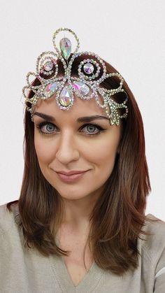 "Elegant rhinestones crown \"Loretta\". This mermaid headpiece will be perfect for your show dance, carnival, burlesque, samba dance, Caribana festival, Mardi gras festival, fusion bellydance, Brazilian carnival and will serve as a bright photoshoot accessory. Crown made of stainless spring steel with zinc coating. Such wire does not rust and is not subject to corrosion. Worldwide shipping ✈ Standard delivery 14-35 days UPS shipping to USA, delivery time 7-10 days If you want delivery as soon as possible, you can order expedite shipping by USPS EXPRESS SHIPPING for an additional fee (only for USA): https://www.etsy.com/AmaliaDesignStudio/listing/1139669654/express-shipping-by-ups-for-usa-expedite  I will be very happy if you visit AmaliaDesign boutique and follow it on social networks: htt Bright Photoshoot, Dance Hair Piece, Ballroom Dance Hair, Mermaid Headpiece, Dancer Legs, Dancer Necklace, Brazilian Carnival, Mardi Gras Festival, Samba Dance