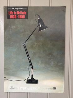 an advertisement for a desk lamp on the wall