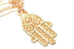 Hamsa necklace, gold hamsa charm, protection necklace, hand of god, amulet necklace, filigree design pendant, yoga jewelry, bohemian jewelry This beautiful gold vermeil hamsa hangs from a 14k gold vermeil chain in the length of your choice. Please feel free to select a different length chain if you prefer! This beauty is also available in sterling silver! Charm measurements: 25mmx15mm The Hand (Khamsa), particularly the open right hand, is a sign of protection that also represents blessings, pow Bohemian Gold Charm Necklaces For Good Luck, Bohemian Gold Charm Necklace For Good Luck, Hamsa Necklace Gold, Hand Of God, Hamsa Charm, Gold Hamsa, Hamsa Necklace, Amulet Necklace, Protection Necklace