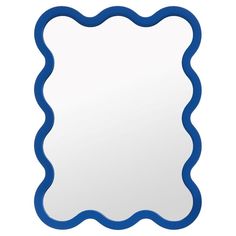 a blue scalloped mirror on a white background