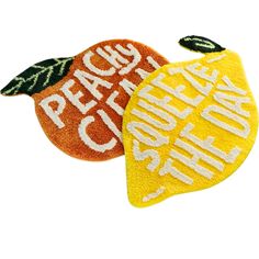 two pieces of fruit with words on them