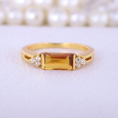 Baguette Cut Citrine Engagement Ring, Cluster Diamond Statement Ring, 10K Solid Gold Women Jewelry, Art Deco Ring, Personalised Gift For Her Description: Main Stone - Citrine ( Lab Created ) Stone Size - 8 x 4 MM Stone color - Yellow Stone shape - Baguette Stone Birth Month: November Second Stone: CZ Diamond Stone Shape: Round Stone Color: Colorless Stone cut - Brilliant Cut Finishing- Excellent feel free to contact me if you have any questions  Gemstone color may slightly vary from listed image November Birth Stone Rings, Gold Topaz Birthstone Ring Gift, Gold Baguette-cut Topaz Ring For Wedding, Gold Baguette Cut Topaz Wedding Ring, Gold Baguette Cut Topaz Ring For Wedding, Rectangular Gold Rings With Accent Stones, Gold Rectangular Rings With Accent Stones, Rectangular Gold Jewelry With Accent Stones, Yellow Gold Topaz Ring With Rectangular Stone