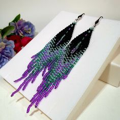 "Seed Bead Earrings 4.5 inch long.Flowing beads earrings.Bohemian dangle beaded earrings. with fringe are made of high quality Czech and Japanese seed beads.V long earrings.Bead weaving techniques. Colors: Black, Purple ,2 color green. ! Details ! Made with quality Japanese and Czech seed beads ! Professional threads for weaving with beads Tytan and Fireline. ! Length 4.5 inches ( 12cm) ! Sterling silver plated ear wire. Simple sterling silver ear wire 925 are included with each earrings. ! INST Purple Bohemian Beaded Tassel Earrings, Bohemian Purple Beaded Tassel Earrings, Dangle Beaded Earrings, Long Beaded Earrings, Earrings Bead, Green Details, Long Tassel Earrings, Beads Earrings, Native American Beading