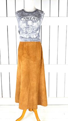 "Vintage Avon tan brown suede leather aline long maxi skirt Measurements...taken flat -marked size: vintage 7/8 -across waist: 13\" -across hip: 18\" -length: 33\" Features... -light brown genuine suede leather -long flowy silhouette -back zipper closure -fully lined -Avon Condition... -excellent vintage condition -minor suede wear" Spring Full Length Brown Skirt, Brown Full-length Skirt For Spring, Brown Full-length Maxi Skirt For Fall, Fall Full Length Brown Maxi Skirt, Brown Full Length Skirt For Spring, Chic Brown Full-length Skirt, Brown Full Length Maxi Skirt For Fall, Chic Full-length Brown Skirt, Chic Full Length Brown Skirt