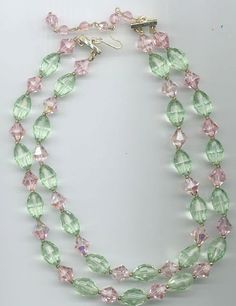 During the heyday of vintage Czech crystal manufacturing, their crystals could take on Swarovski crystals one-on-one without backing down. This beautiful double-stranded vintage necklace showcases these highest-quality Czech crystals. There are 10 mm faceted bicone crystals in the color rosaline aurora borealis, alternated with 16 x 9 mm faceted oval crystals in the color chrysolite (which is a bit greener than Swarovski chrysolite). The crystals are in mint condition. The shorter strand of this Hell Rosa, Oval Beads, Czech Crystal, Vintage Crystal, Aurora Borealis, Artisan Jewelry, Vintage Necklace, Crystal Necklace, Jewelry Inspiration