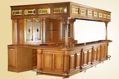 an old fashioned wooden bar with stained glass windows