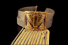 "This is a very beautiful, vintage and very unique BRUTALIST SANDOR BRASS SILVER TONE choker collar necklace. The necklace has a marvelous, chic brutalist style with brass center decoration, dangle chains and silver tone metal. The bottom has SANDOR Co. The necklace has a very extravagant and elegant feel to it. It measures 14\" x 1 1/2\" and 3 1/4\" long dangles. The necklace is in very good condition. 0.7 BR" Silver Vintage Brass Choker, Vintage Metal Choker For Evening, Vintage Metal Evening Choker, Good Luck Necklace, Blue Sapphire Necklace, Dangle Necklace, Choker Collar Necklace, Garnet And Gold, Brass Bangle