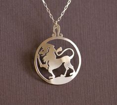 "The Lion This design was hand cut from a sheet of solid .925 sterling silver using a jeweler's saw. It measures 1 7/16\" x 1 1/8\" (3.65cm x 2.86cm) and is 0.66mm thick. Topped by the glyph of Leo, this pendant will hang from a sterling silver necklace of your length choice. All of our jewelry comes in a gift box ready for giving. A simpler Leo pendant can be found here: https://www.etsy.com/listing/578578100/leo-hand-cut-sterling-silver-glyph" Silver Laser Engraved Jewelry For Anniversary, Laser Engraved Sterling Silver Jewelry, Symbolic Etched Sterling Silver Jewelry, Symbolic Silver Jewelry With Laser Engraving, Symbolic Silver Laser Engraved Jewelry, Symbolic Laser Engraved Silver Jewelry, Symbolic Silver Necklace With Laser Engraving, Sterling Silver Laser Engraved Pendant, Laser Engraved Sterling Silver Pendant