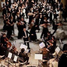 a large group of people playing musical instruments