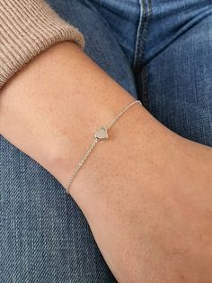 Dainty Tiny Heart Bracelet, Gold Plated Heart Charm, Monogram Letter Bracelet, Bridesmaid Gift, Girlfriend Gift, Personalized, Lovers Gift Treat yourself to the minimalist look of this gold plated heart bracelet. It looks just as amazing worn by itself, as it does stacked with one of our bracelets available in our store. The heart measures approximately 1 cm and it moves loosely on the delicate cable chain. Also a perfect gift for your bff, your bridesmaids, or a special person in your life. Det White Heart Bracelet For Wedding, White Heart-shaped Bracelet For Weddings, White Heart-shaped Wedding Bracelet, Wedding Heart Beads Charm Bracelet, Heart-shaped Charm Bracelet For Wedding, Heart Charm Jewelry For Bridesmaid Gift, Valentine's Day Heart Bracelet For Wedding, Delicate Heart Bracelet With Heart Charm For Mother's Day, Dainty Heart Beads Bracelet For Wedding