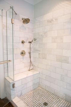 an instagram photo of a shower with white tile on the walls and floor, along with text that reads post kartnaportened designs homewood, alabama