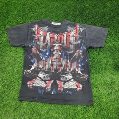 Vintage Tapout Shirt Medium 19x26 Black Rock a vintage look with this black Tapout shirt, medium size, 19x26. Ideal for MMA and retro fashion fans!  * Used condition  * Length is on the shorter side  * Rips/Holes: Yes (see picture and zoom in to see size/location)  * Stains (see picture and zoom in to see size/location)  * Normal fading from washing  * Heavy cracking on the graphic VINTAGE TAPOUT SHIRT, BLACK TAPOUT TEE, MEDIUM SIZE, TAPOUT CLOTHING, 19X26 INCHES, RETRO TAPOUT, MMA APPAREL, VINT Tapout Clothing, Tapout Shirt, Mma Clothing, Lake Elsinore, Black Rock, Rock A, Black Media, Vintage Look, Vintage Looks