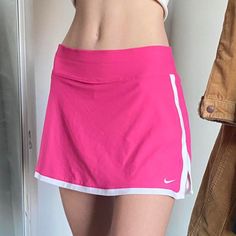 Pink Nike Tennis Skirt With Design! (Never Worn!) -Size:Xl (True To Size!) -First Photo Is A Reference Of How The Skirt Looks On Someone But The Rest Are The Actual Skirt With The Pattern! -Super Cute Skirt With Under Shorts And Has Such A Cute Pattern That’s Totally Unique ! -Let Me Know If You Wanna Buy!! #Skirt #Nike #Y2k #Athletic #2000’s Sporty Pink Skirted Bottoms, Casual Nike Fitted Tennis Skirt, Y2k Style Lined Skort, Nike Fitted Tennis Skirt For Spring, Pink Sporty Skirted Skort, Nike Tennis Skirt For Spring, Pink Sporty Lined Skort, Casual Nike Stretch Tennis Skirt, Sporty Short Pink Skirt