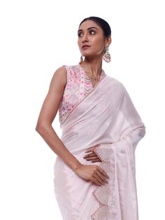 Look like a royalty in this exquisite powder pink chiffon saree at weddings and special occasions. It has an embroidered scalloped border and comes with a beautiful embroidered blouse. Pink Georgette Pre-draped Saree With Embroidered Border, Elegant Pink Pre-draped Saree With Intricate Embroidery, Wedding Georgette Blouse With Embroidered Border, Reception Saree With Embroidered Border In Pink, Elegant Pink Blouse With Sheer Dupatta, Elegant Pink Blouse With Intricate Embroidery, Designer Georgette Blouse With Embroidered Border, Feminine Festive Wedding Blouse, Elegant Silk Blouse With Embroidered Border