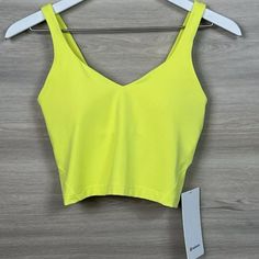 Nwt Lululemon Align Cropped Style Tank Top Electric Lemon Yellow Size 12 Gorgeous Nwt When Feeling Nothing Is Everything. The Align Collection, Powered By Nulu Fabric, Is So Weightless And Buttery Soft, All You Feel Is Your Practice. Nulu Lightweight, Buttery-Soft Nulu Fabric Wicks Sweat And Is Four-Way Stretch Buttery-Soft Handfeel Lightweight Sweat-Wicking Four-Way Stretch Features Designed For: Yoga Light Support: Built-In Shelf Bra Intended To Provide Light Support. Sizes 0-14 Fit A/B Cups, Yoga Light, Lululemon Align Tank, Style Tank Top, Running Tank Tops, Purple Tank, Lululemon Tank, Lululemon Align, Workout Tanks, Cropped Style