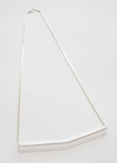 Minimal Glass Tube Necklace No. 5- Each piece is handmade producing similar yet one of a kind results. - Borosilicate glass tube with slight bend. Measures approx. 4". - Displayed on your choice of gold or silver plated brass chain. Measures 22". See more of my glass necklaces here: https://www.etsy.com/shop/UrbanRevisions?section_id=12314363-------------------------------------------------------------------Made to order : product will ship within 7 business days. Please read shop policies befor Tube Necklace, May 31, No 5, Brass Chain, Glass Necklace, Bend, Arrow Necklace, Silver Plate, Gold Necklace