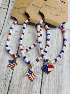 Get your one-of-a-kind, pretty, little thing from Doohickies & Such.  Sign up for the VIP newsletter to get insider news before anyone else! http://eepurl.com/hdVZk9  Choose between a USA Flag, USA Heart, or USA star beaded bracelet. Each bracelet has a mix of red, white and blue seed beads. Accents of gold beads are used too. This is a great summer piece. Measuring 7.25" and is stretchy, made with double 0.5mm stretch cord.   Made with love and from a smoke free home. WEAR AND CARE: No piece should be submerged in water for these are not made with real gold or silver. Try and avoid harsh chemicals when wearing your jewelry piece (i.e. cleaners, perfume and lotions). This item is handmade with love, so please try to not stretch or tug at the pieces so they can keep their shape. Follow me o Star Beaded Bracelet, Patriotic Bracelet, Flag Bracelet, Beads Art, Blue Beaded Bracelets, African Beads, Usa Flag, Bead Art, Red White And Blue