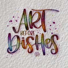 the words art before dishes are painted in watercolor on white paper with colorful spots