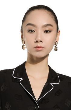 Bring the Italian label's signature glamour to any look with sleek drop earrings flaunting the iconic interlocking monogram and lustrous imitation pearls. Clip-on style Goldtone plate/plastic imitation pearl Made in Italy Luxury Pearl Drop Earrings For Evening, Luxury Earrings For Workwear, Black Pearl Earrings For Formal Occasions, Interlocking Monogram, Dg Logo, Clip On Earrings, Dolce And Gabbana, Gold Tones, Sleek