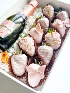 a wine bottle and some chocolates in a box