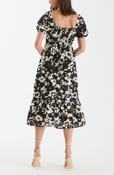 An abstract floral print boosts the whimsical appeal of a midi-length dress shaped by a gathered bodice and delicate puff sleeves. 47 1/4" length (size Small) Square neck Short puff sleeves 80% rayon, 20% nylon Hand wash, dry flat Imported Flowy Floral Print Midi Dress With Puff Sleeves, Chic Floral Print Maxi Puff Sleeve Dress, Chic Puff Sleeve Maxi Dress With Floral Print, Chic Floral Print Puff Sleeve Maxi Dress, Flowy Puff Sleeve Midi Dress With Floral Print, Chic Puff Sleeve Floral Maxi Dress, Spring Midi Puff Sleeve Dress With Smocked Back, Spring Midi-length Puff Sleeve Dress With Smocked Back, Chic Flowy Floral Dress With Puff Sleeves