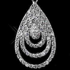 a large white diamond pendant on a black background