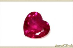 a heart shaped ruby stone on a white background