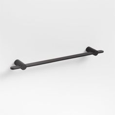 two black handles on a white wall