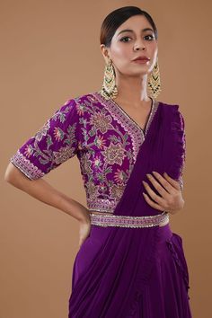 Purple can can attached draped lehenga saree in layered silhouette embellished by sequins and border frill detail. Comes with padded thread floral embroidered blouse and sequin embellished belt. - Aza Fashions Elegant V-neck Lehenga With Resham Embroidery, Elegant V-neck Lehenga With Zari Work, Elegant V-neck Choli With Resham Embroidery, Wedding Choli With Zari Work And V-neck, Festive V-neck Lehenga With Dupatta, Designer V-neck Choli With Resham Embroidery, V-neck Blouse Piece For Diwali Reception, Fitted Silk V-neck Set, V-neck Wedding Dress For Diwali