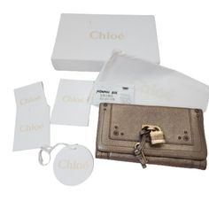 Chloe Paddington Leather Wallet Purse Metallic Gold (Lock, Key, Dust Bag, Box And Card) Used Condition. Size (Approximately): 7 1/2 Inches X 4 1/8 Inches Refence Number F-45 Chloe Bags, Box Card, Chloe Bag, Card Box, Metallic Gold, Purse Wallet, Leather Wallet, Gold Metal, Chloe