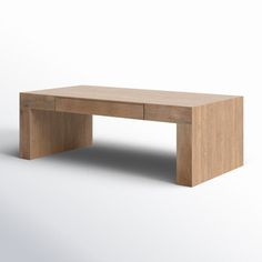 a wooden table sitting on top of a white floor