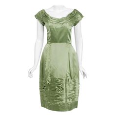 Such an elegant and timeless 1950's cocktail dress from the Evelyn Brown Washington D.C designer label. Perfect for any upcoming party; you can't help but feel feminine in this beauty! The garment is fashioned from a stunning mid-weight lined sage green silk satin fabric. The bodice has an exquisite slight off-shoulder scoopneck with classic short-sleeves. The complex ruching adds the perfect amount of depth and texture. This same gorgeous ruching, with bow appliques, in repeated on the skirt. T Black Lace Party Dress, Gowns Aesthetic, 1950s Cocktail Dress, 1950s Outfits, Vintage Slip Dress, Velvet Cocktail Dress, Silk Satin Fabric, Lace Party Dresses, Designer Label