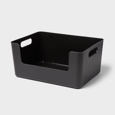 a black plastic container with handles on the top and bottom, sitting in front of a white background