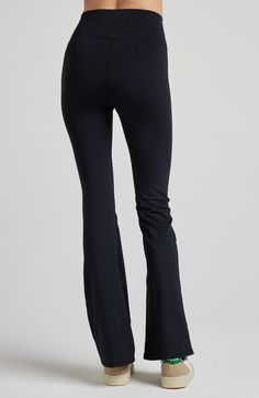 These leggings feature a high-rise waistband and a flirtatious flare below the knee, evoking memories of carefree days. Crafted from our high-performance SculptLux fabric, they wrap you in a luxurious second-skin embrace, offering support that allows you to move gracefully through life's every step. At LOSANO we help elevate every moment with clothing that is better for you! High waist Bootcut flare Sculpting Moisture wicking UV protective PFA Free BPA free Made from sustainable materials Oeko-t High Rise Black Bottoms For Pilates, Mid-rise Tight Pants For Athleisure, Black Mid-rise Bottoms For Pilates, Sporty High Rise Bottoms With Wide Waistband, Black Wide Leg Bottoms For Pilates, Mid-rise Compression Yoga Pants, High Rise Compression Pants With Contoured Waistband, Tight Athleisure Elastane Bottoms, Tight Elastane Athleisure Bottoms