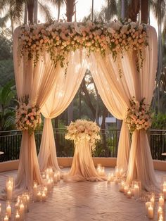 an outdoor wedding setup with candles and flowers