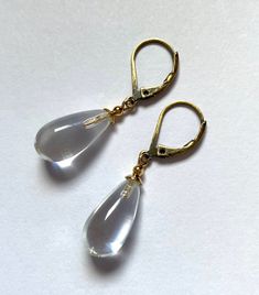 "Crystal clear glass earrings. Clear glass drops, designed by Allen Owen and made for us in Germany. \"Brights 6\" earrings measure 7/8 inches in length. Ear wires are 14k. gold filled or antiqued brass lever backs. All hand work done in the USA. Owen Glass Collection jewelry is ready for gift giving, with earrings backs, an organza bag and description card included. Please let us know if you would like us to make a matching bracelet or necklace of any length. All custom orders are welcome. ♥ Fo Minimalist Teardrop Glass Jewelry, Glass Drop Earrings With Matching Set, Modern Glass Teardrop Earrings, Everyday Glass Drop Earrings, Glass Drop Earrings For Formal Occasions, Minimalist Glass Dangle Earrings, Minimalist Glass Drop Earrings, Formal Glass Drop Earrings, Formal Clear Teardrop Earrings